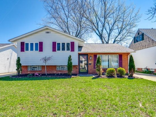 Split-level home with maroon shutters in Euclid, Ohio